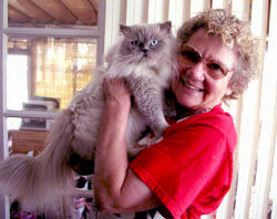 A photo of our founder Wanda with her cat Elvis